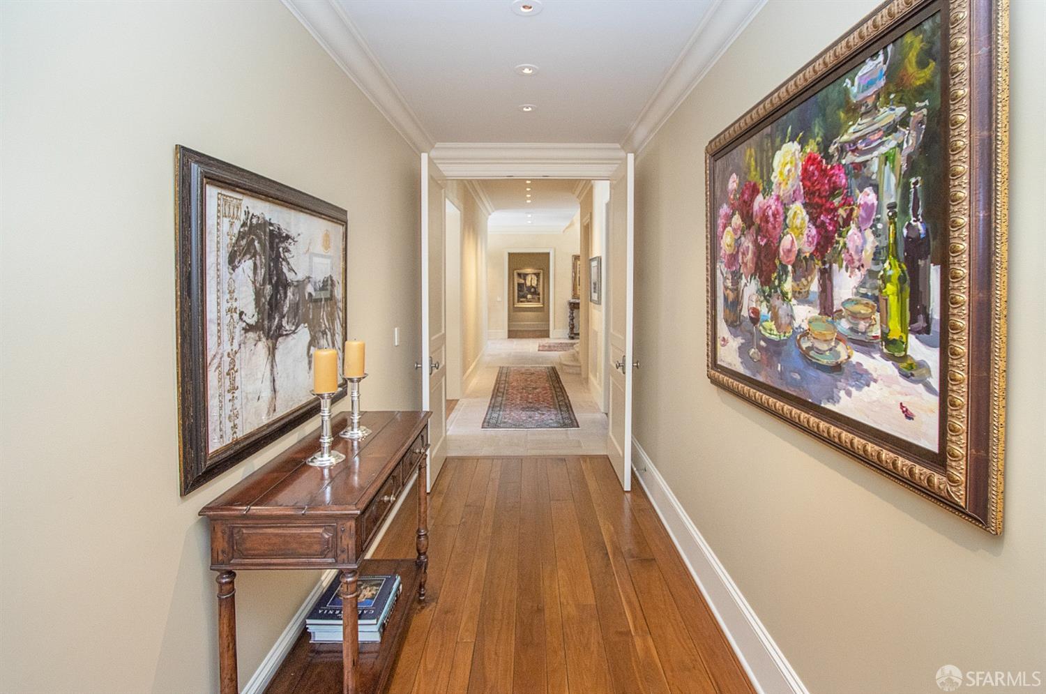 75 Almendral Avenue Atherton, CA 94027 - Photo 22 of 40 a view of a hallway with paintings on the wall