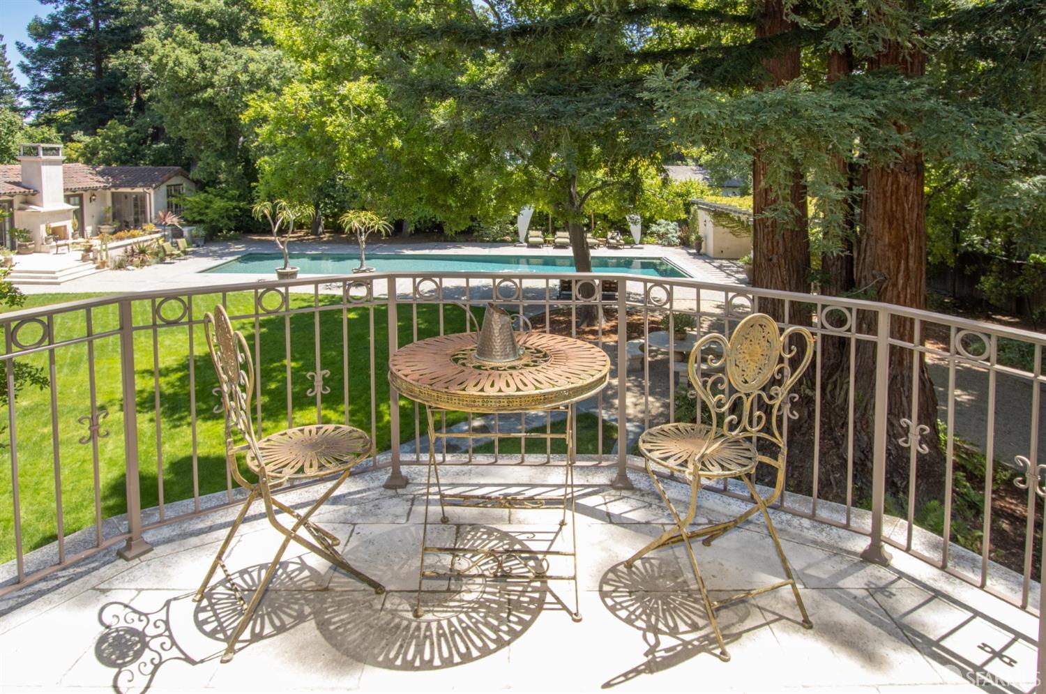 75 Almendral Avenue Atherton, CA 94027 - Photo 24 of 40 a view of a chair and tables in the patio