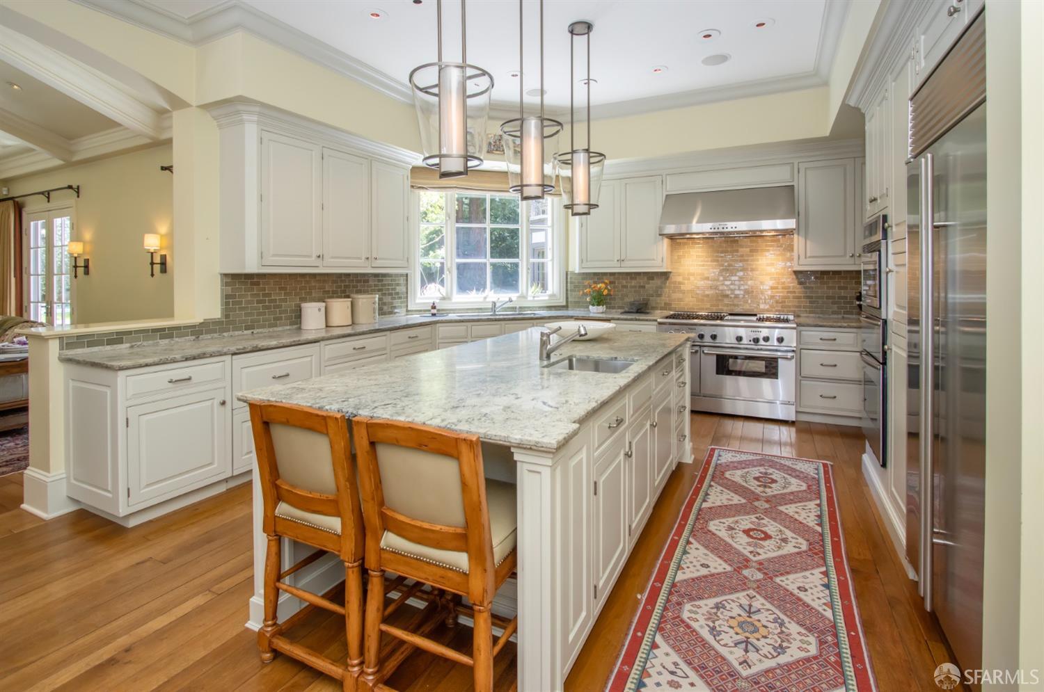 75 Almendral Avenue Atherton, CA 94027 - Photo 27 of 40 a kitchen with stainless steel appliances granite countertop a stove a sink and a refrigerator