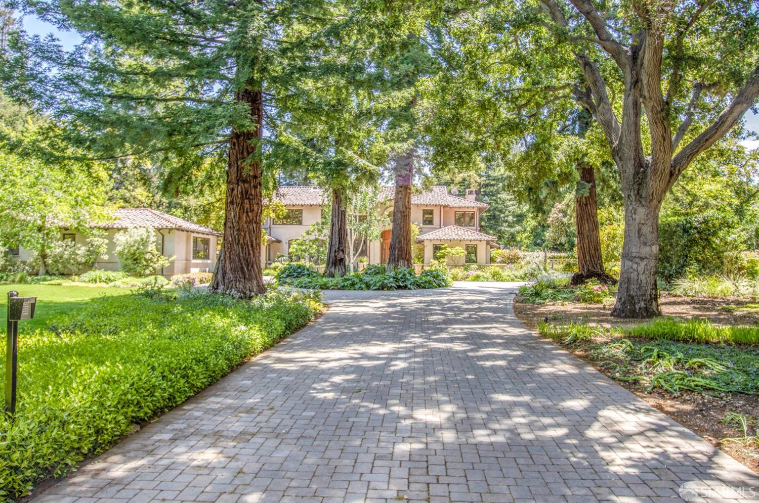 75 Almendral Avenue Atherton, CA 94027 - Photo 3 of 40 a view of a park with large trees