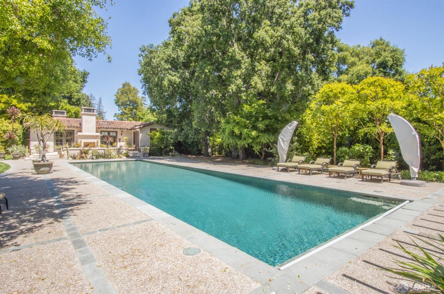 75 Almendral Avenue Atherton, CA 94027 - Photo 34 of 40 a view of swimming pool and trees in the background