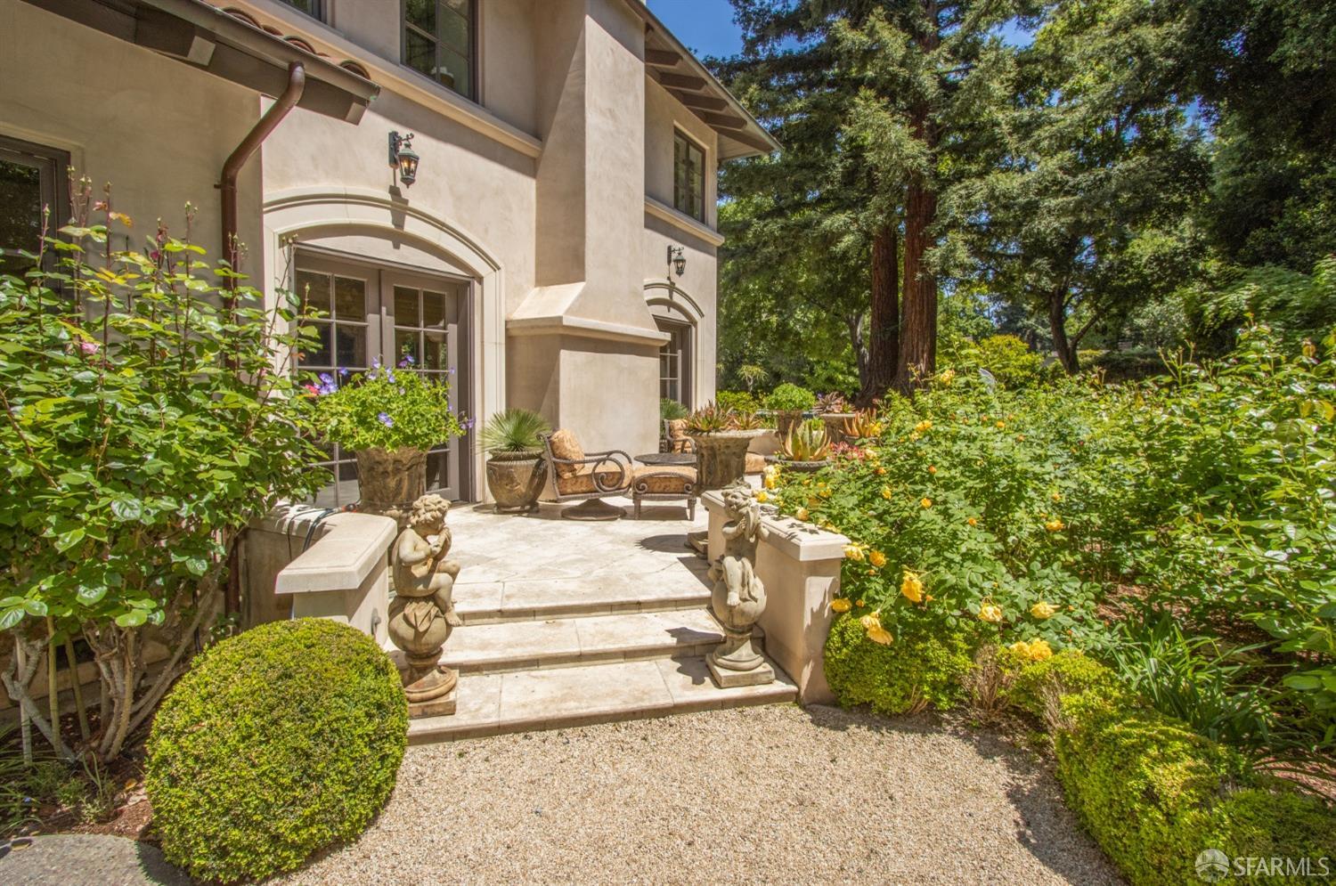 75 Almendral Avenue Atherton, CA 94027 - Photo 40 of 40 a view of a white house with a yard and potted plants