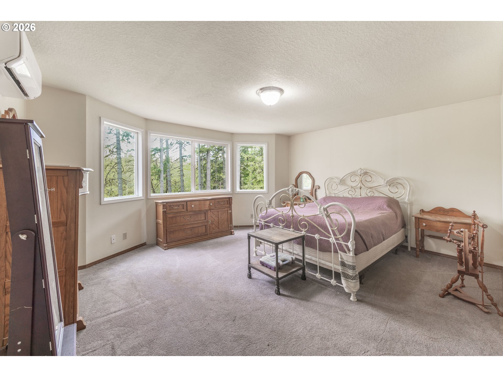 60045 Northwest Railroad Avenue Timber, OR 97144 - Photo 13 of 41 a bedroom with a bed and a window