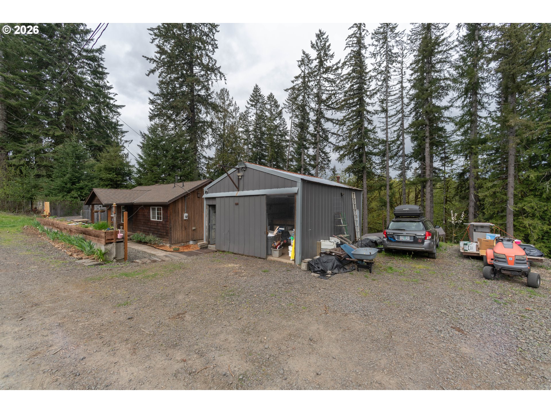 60045 Northwest Railroad Avenue Timber, OR 97144 - Photo 2 of 41 a view of a house with a patio