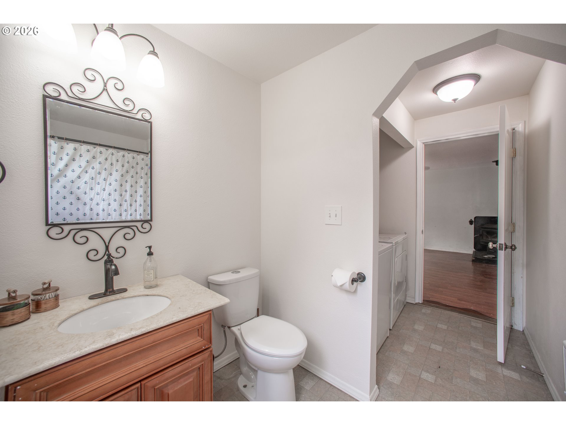 60045 Northwest Railroad Avenue Timber, OR 97144 - Photo 21 of 41 a bathroom with a granite countertop sink toilet and shower