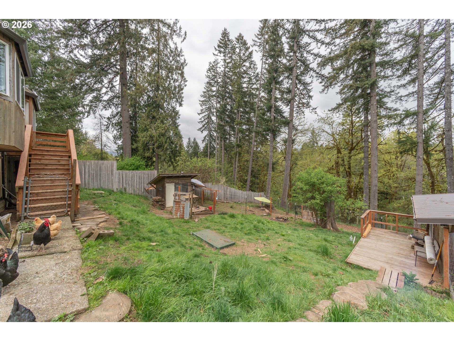 60045 Northwest Railroad Avenue Timber, OR 97144 - Photo 24 of 41 a backyard of a house with table and chairs