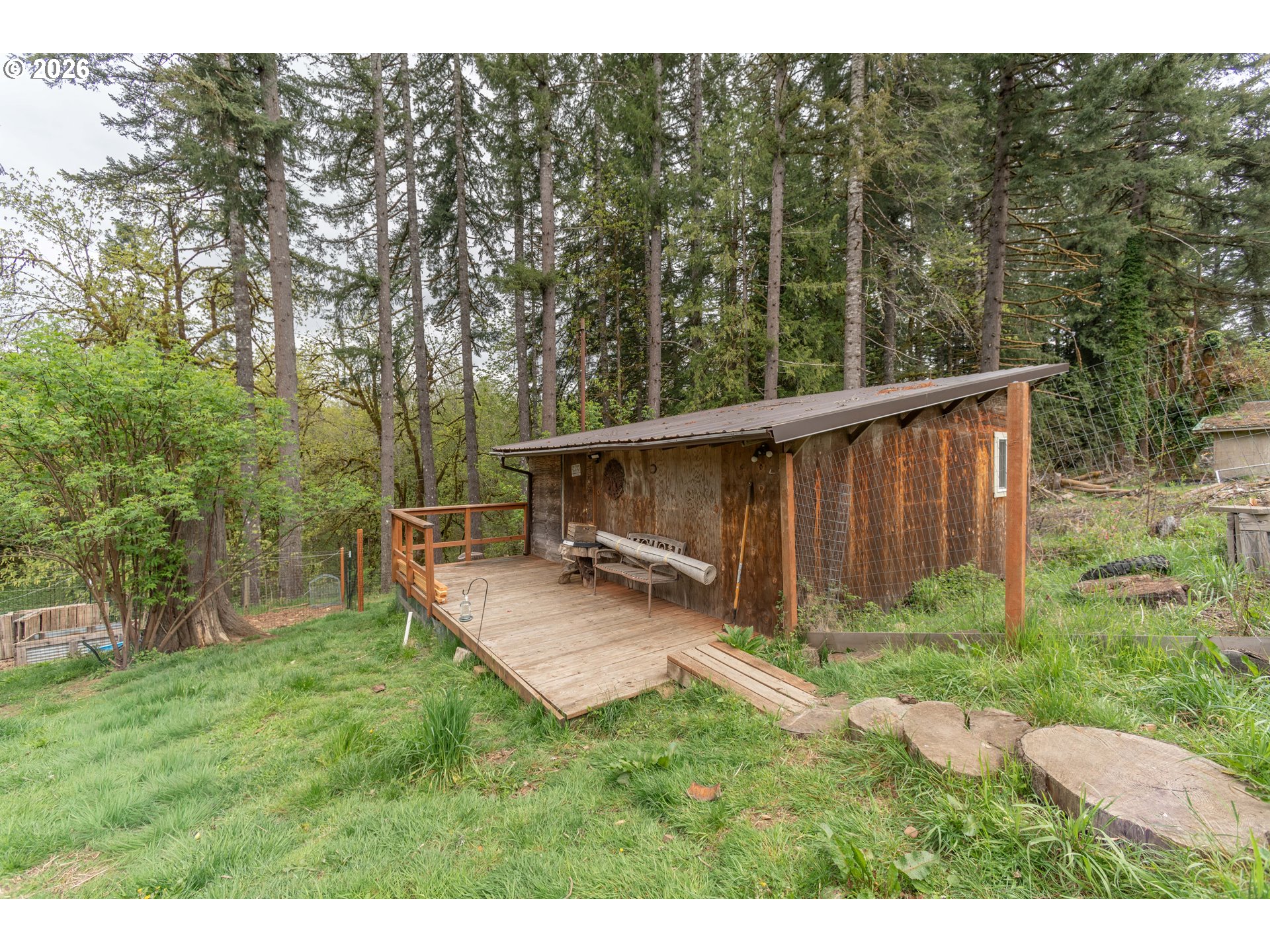 60045 Northwest Railroad Avenue Timber, OR 97144 - Photo 25 of 41 a view of a backyard with trees