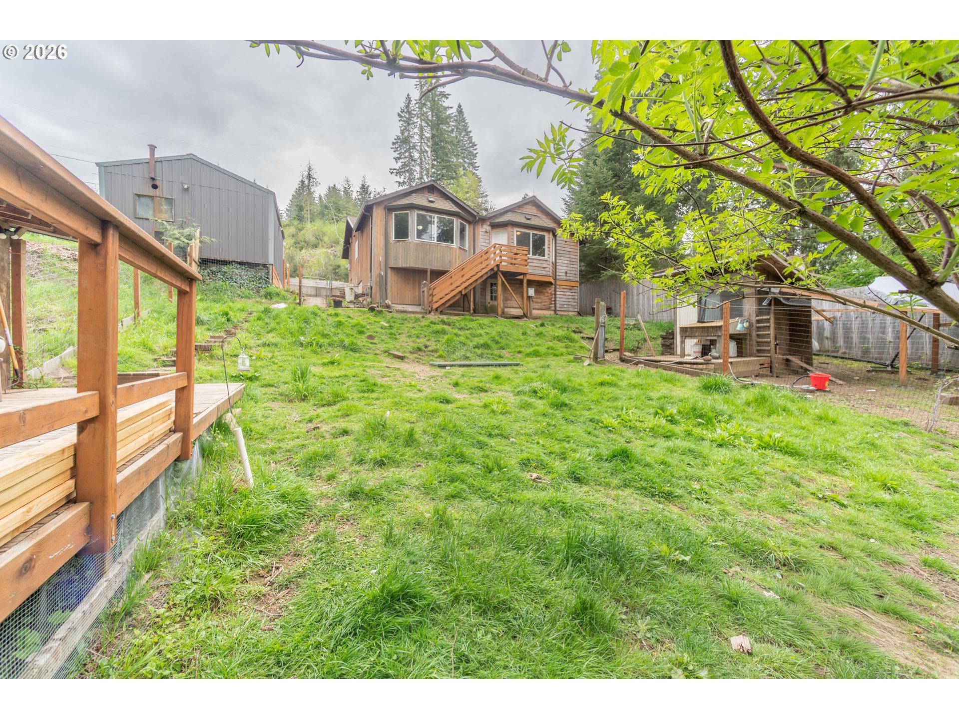 60045 Northwest Railroad Avenue Timber, OR 97144 - Photo 41 of 41 a view of a house with a yard and sitting area
