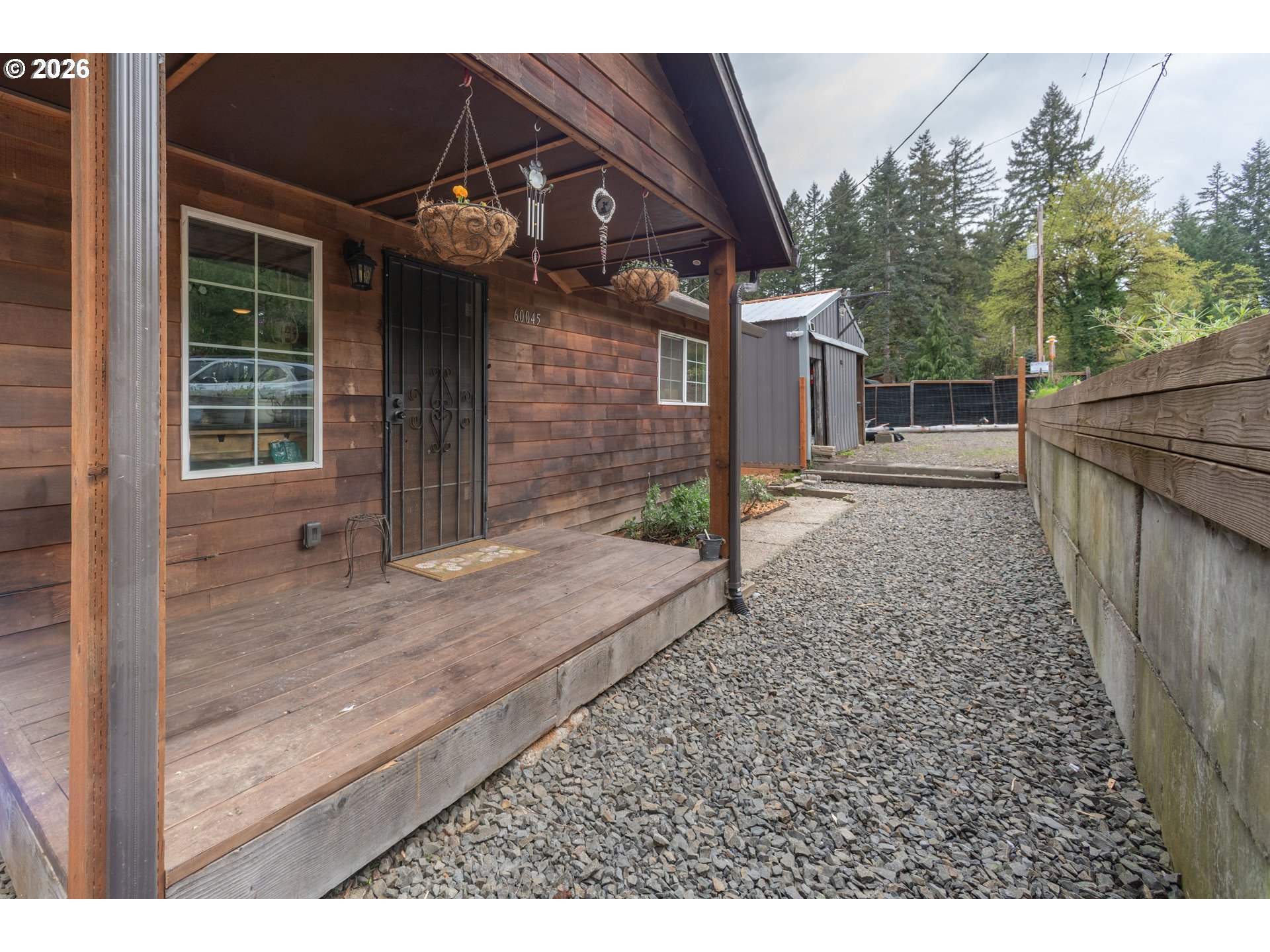 60045 Northwest Railroad Avenue Timber, OR 97144 - Photo 5 of 41 a view of a house with a porch
