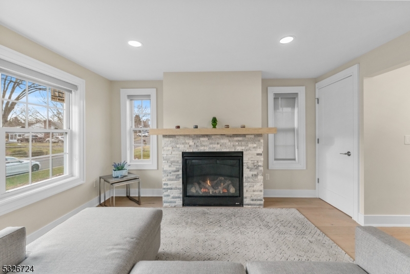 147 Chestnut Street Bridgewater, NJ 08807 - Photo 2 of 13 a living room with furniture and a fireplace