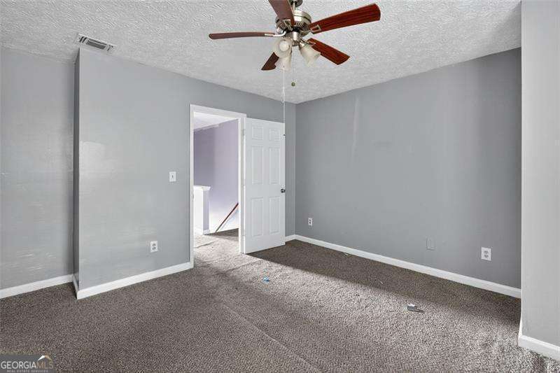 5957 Friar Court, Unit A Atlanta, GA 30349 - Photo 12 of 16 a view of an empty room