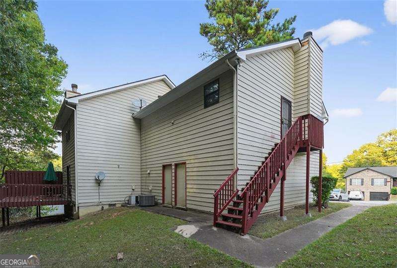 5957 Friar Court, Unit A Atlanta, GA 30349 - Photo 15 of 16 a view of a house with a yard