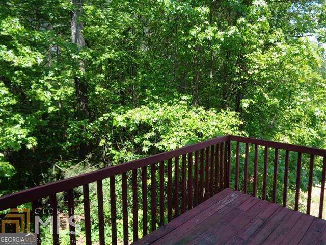 5957 Friar Court, Unit A Atlanta, GA 30349 - Photo 16 of 16 a balcony with wooden floor