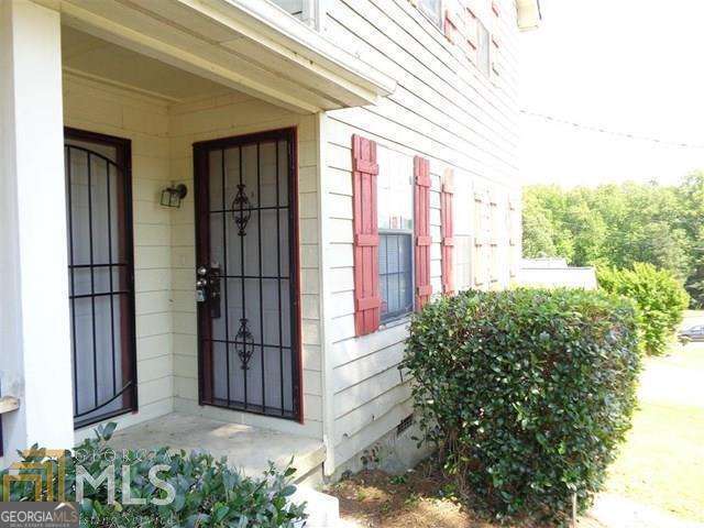 5957 Friar Court, Unit A Atlanta, GA 30349 - Photo 2 of 16 a view of a house with a flower garden