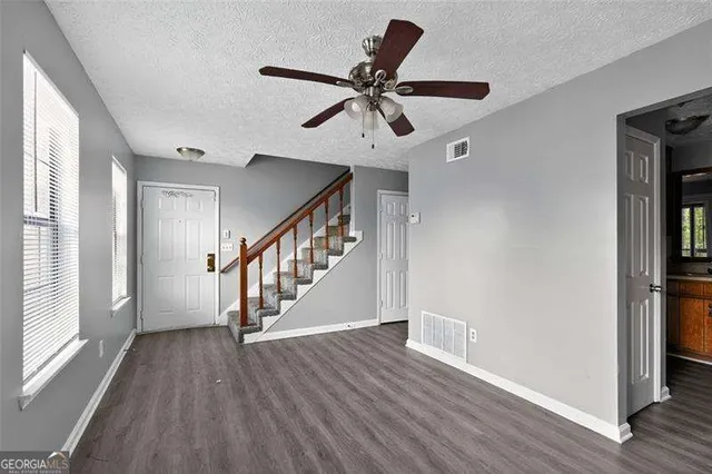 a view of an entryway with wooden floor