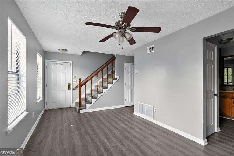 5957 Friar Court, Unit A Atlanta, GA 30349 - Photo 5 of 16 a view of an entryway with wooden floor