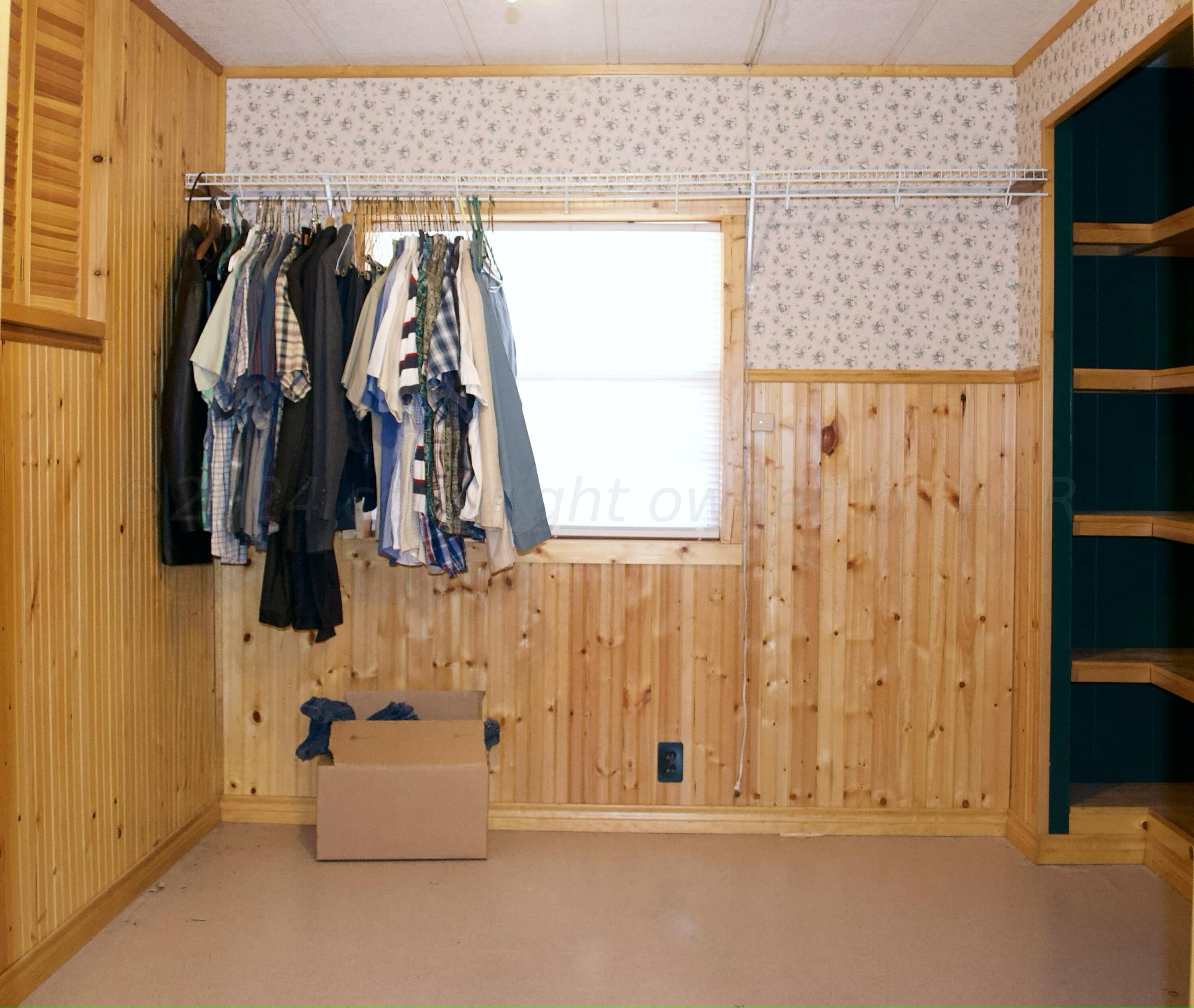531 West Studebaker Avenue Amarillo, TX 79108 - Photo 13 of 25 a view of walk in closet with clothes and shoes
