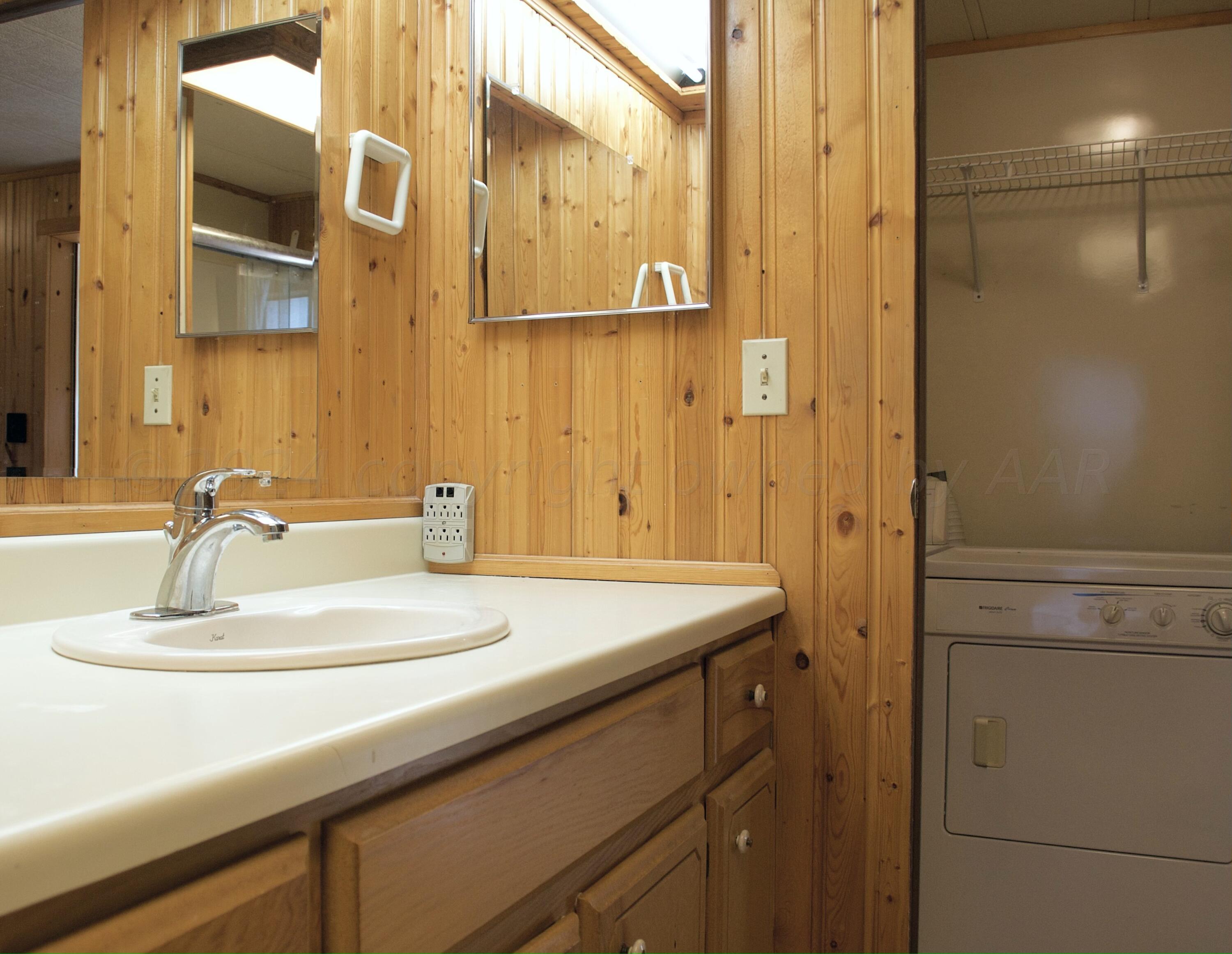 531 West Studebaker Avenue Amarillo, TX 79108 - Photo 16 of 25 a bathroom with a sink and a mirror