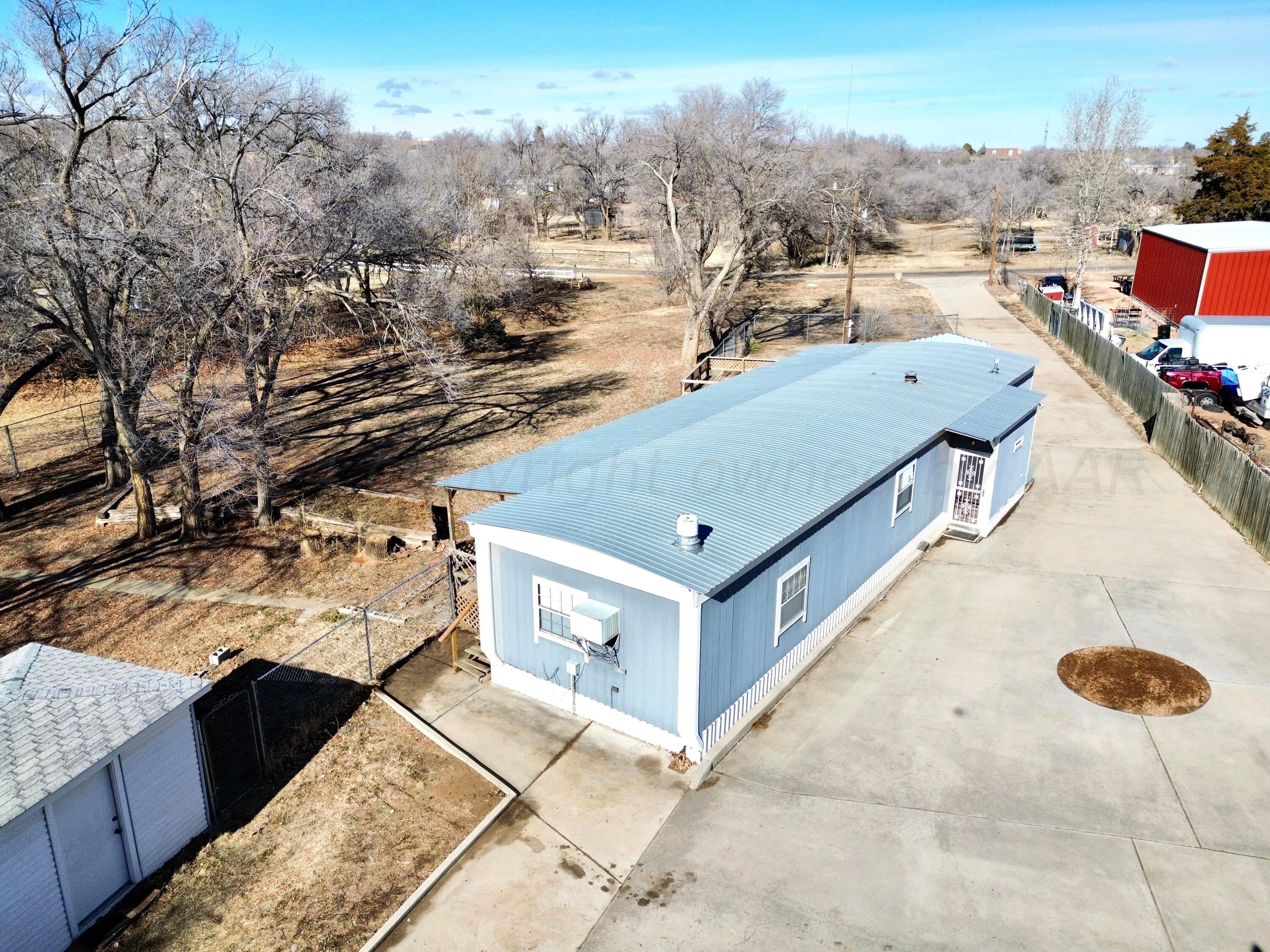 531 West Studebaker Avenue Amarillo, TX 79108 - Photo 2 of 25 a view of a house with a backyard