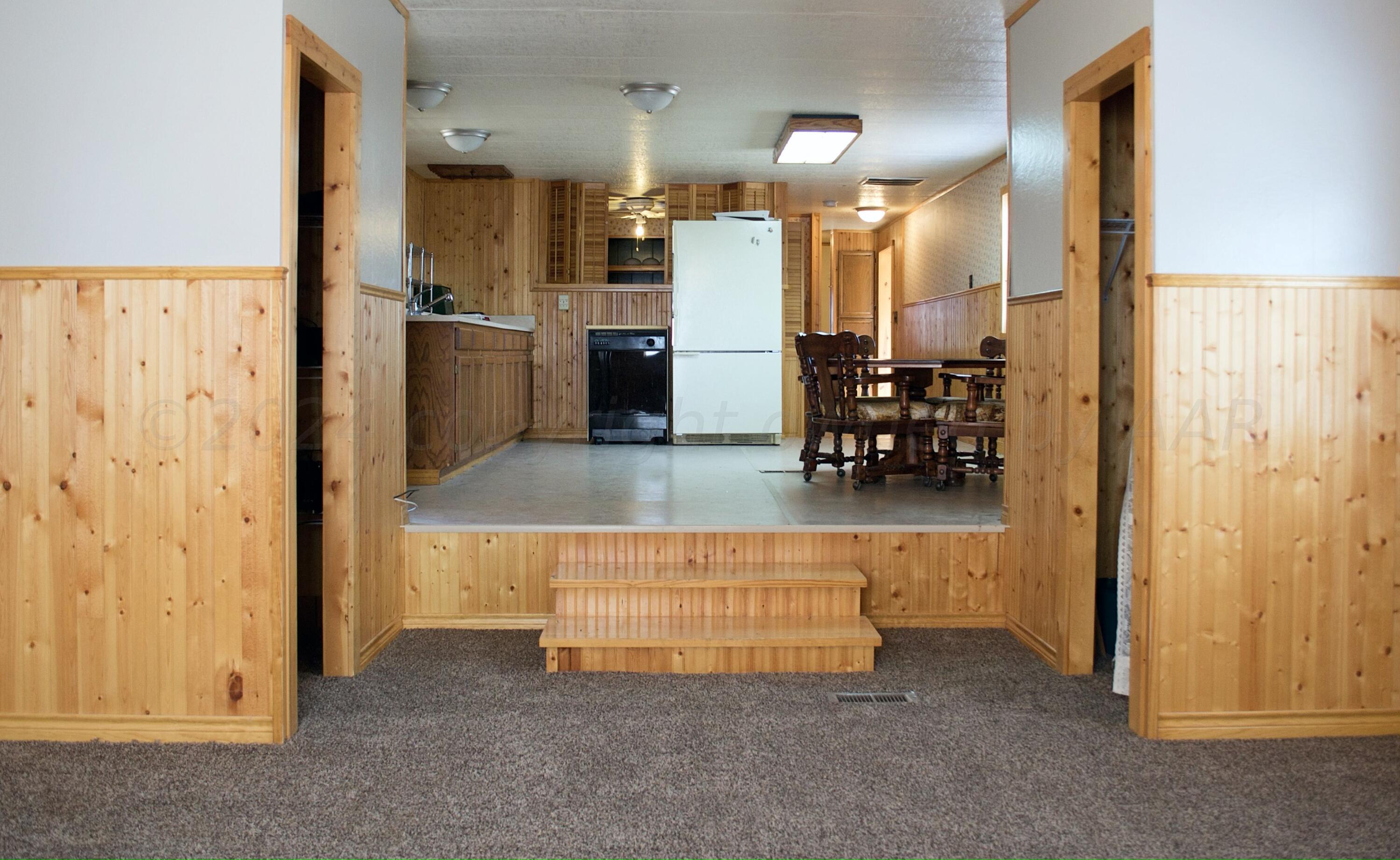 531 West Studebaker Avenue Amarillo, TX 79108 - Photo 10 of 25 a kitchen with refrigerator and chairs