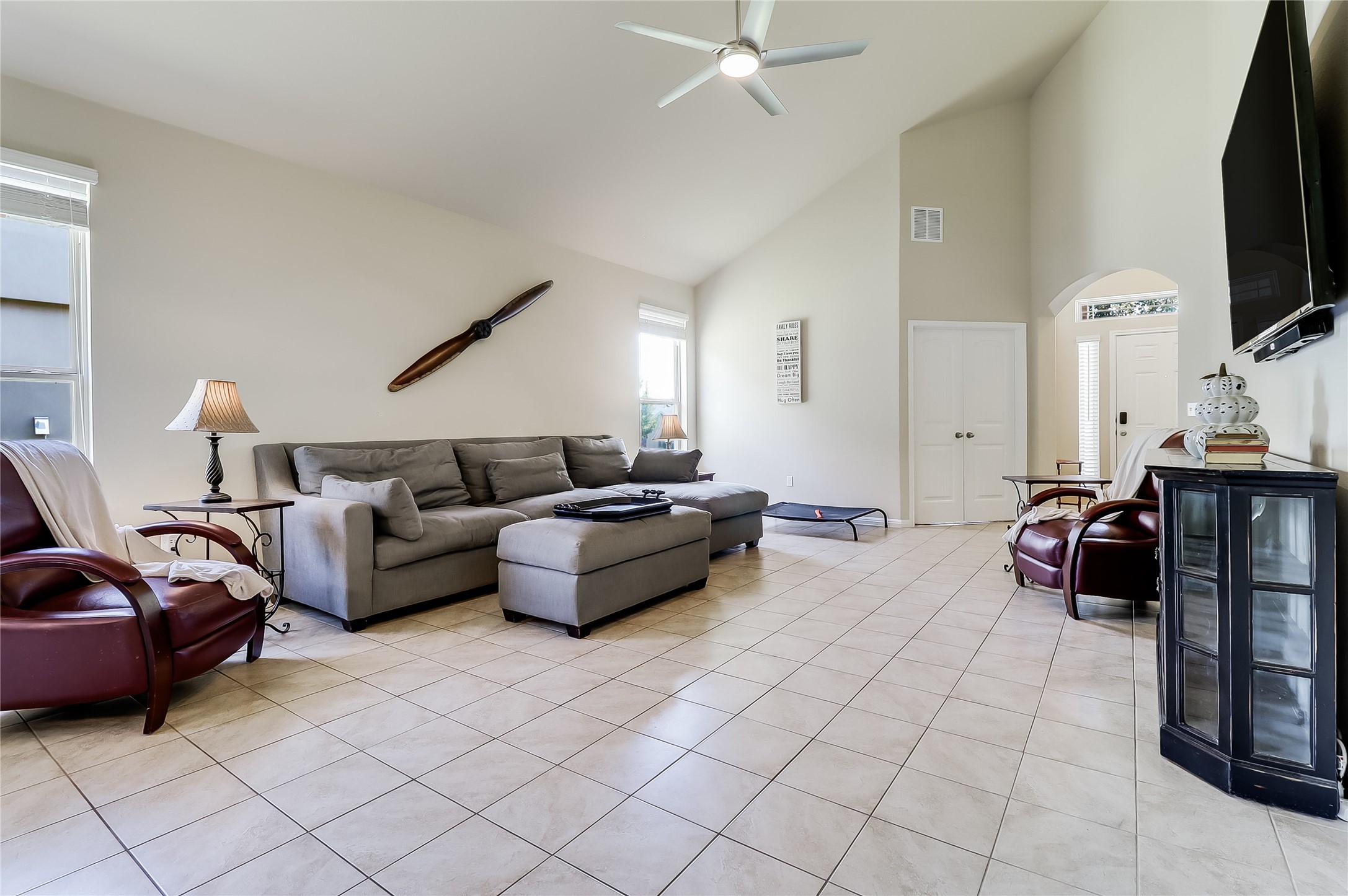 1425 Hamiltons Way Leander, TX 78641 - Photo 20 of 38 a living room with furniture and a flat screen tv