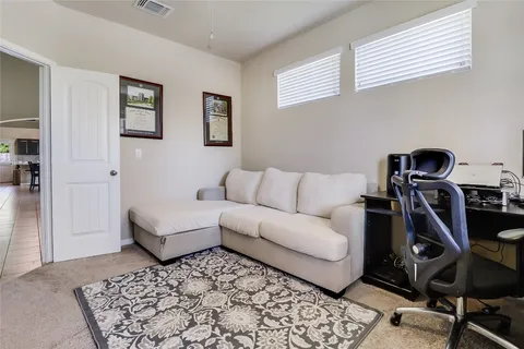 a living room with furniture and a rug