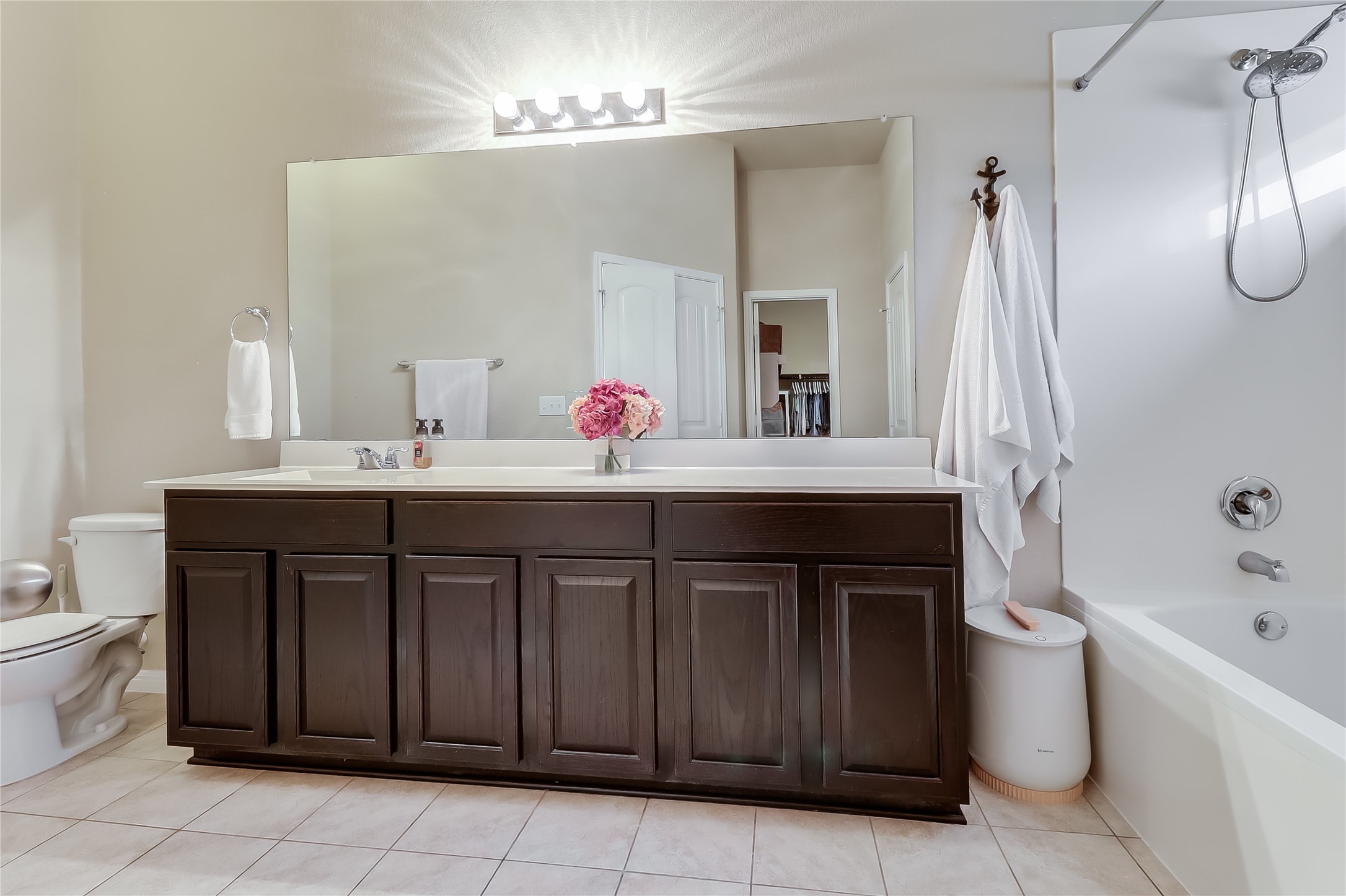 1425 Hamiltons Way Leander, TX 78641 - Photo 30 of 38 a bathroom with a sink and a mirror