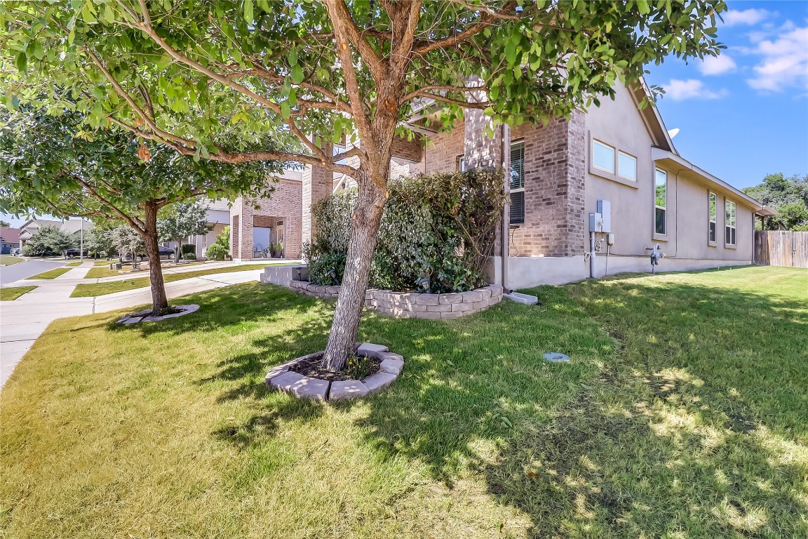 1425 Hamiltons Way Leander, TX 78641 - Photo 34 of 38 a front view of a house with a yard