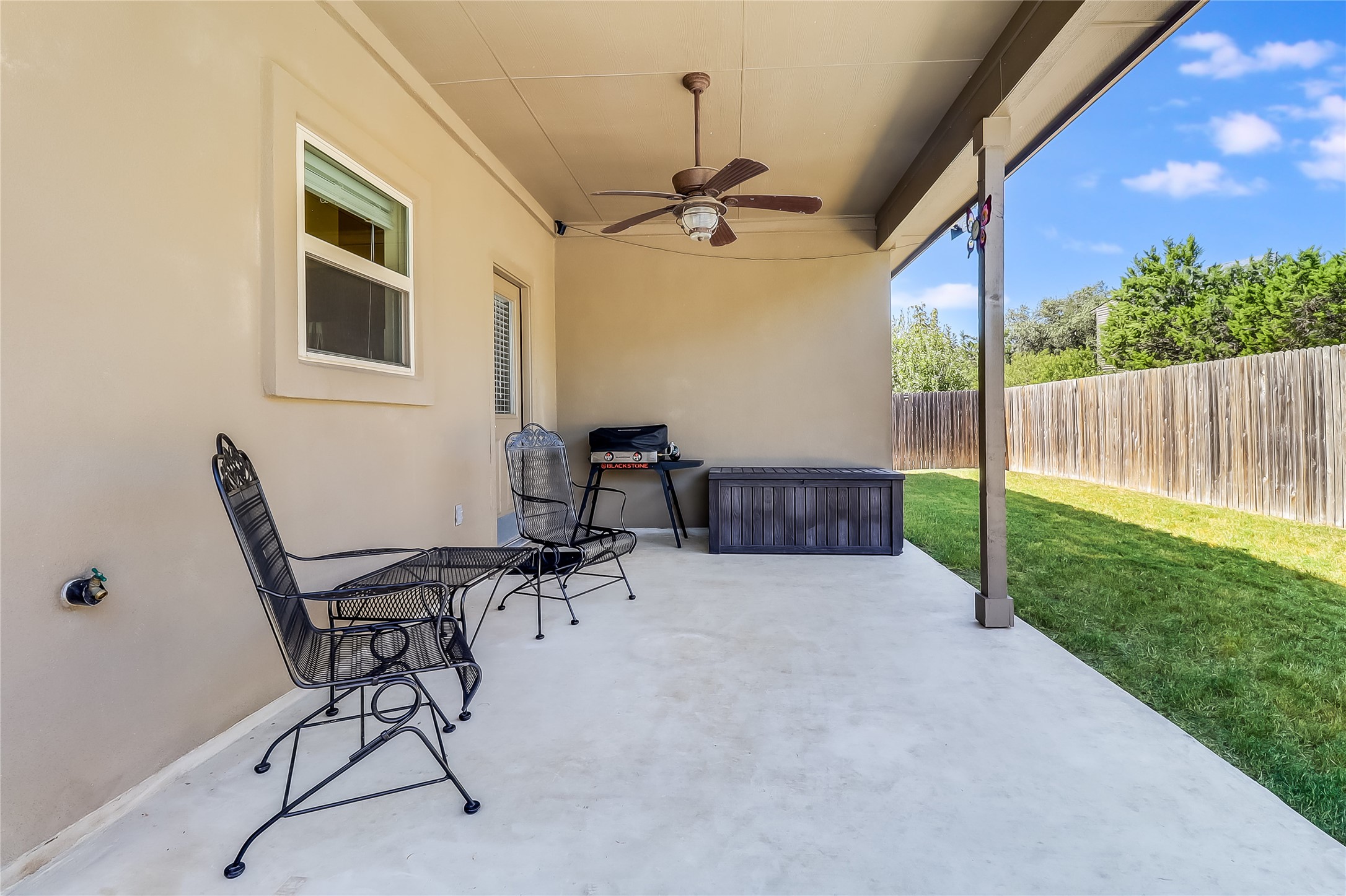1425 Hamiltons Way Leander, TX 78641 - Photo 37 of 38 a view of a patio with a table and chairs