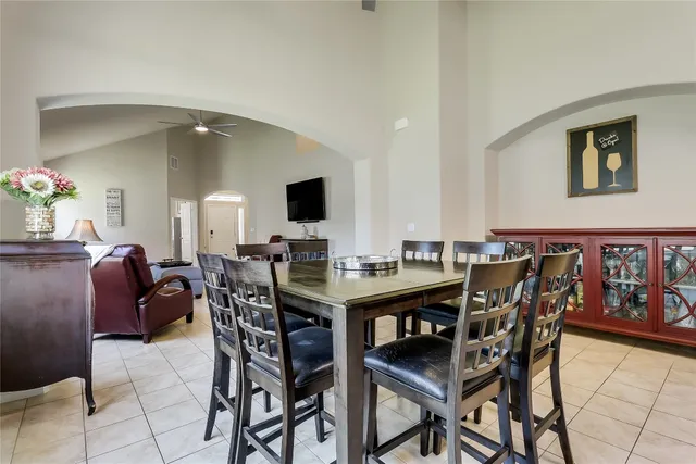 a view of a dining room with furniture and a potted plant