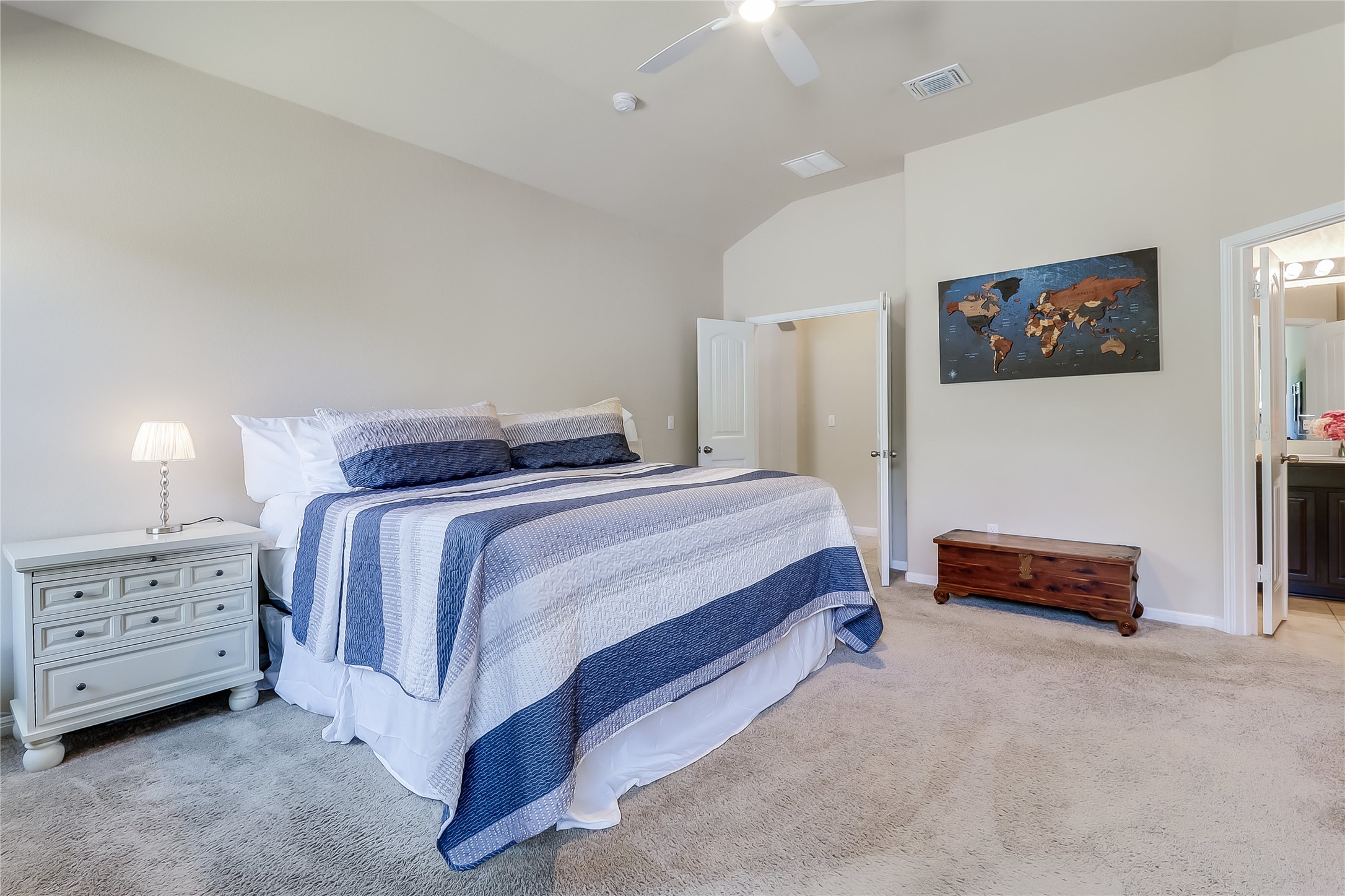 1425 Hamiltons Way Leander, TX 78641 - Photo 5 of 38 a bedroom with a bed and a lamp