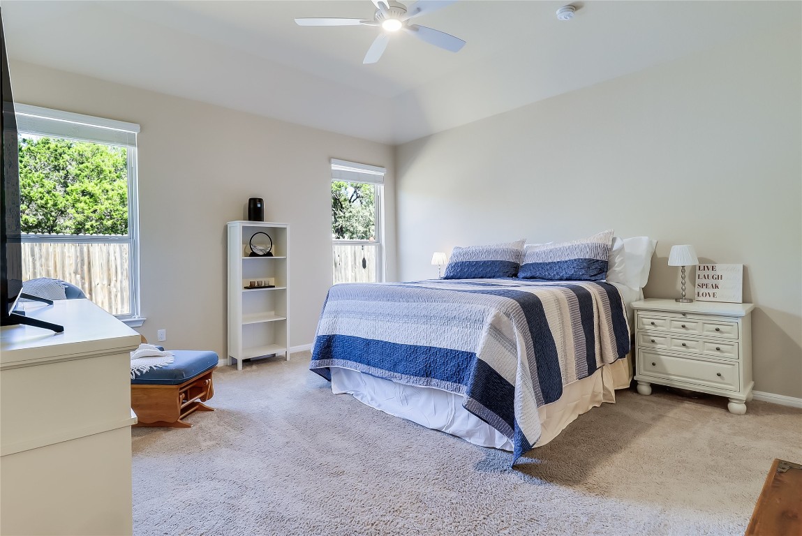 1425 Hamiltons Way Leander, TX 78641 - Photo 6 of 38 a bedroom with a bed and a chair