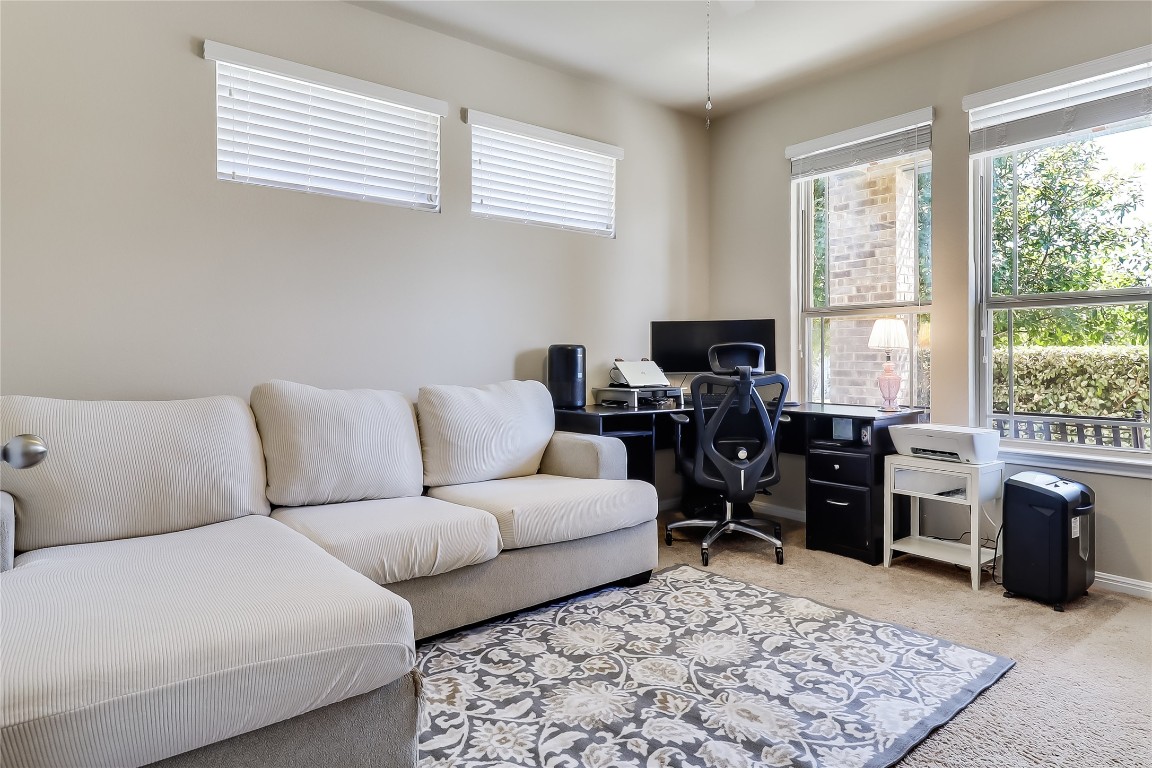 1425 Hamiltons Way Leander, TX 78641 - Photo 9 of 38 a living room with furniture rug and window