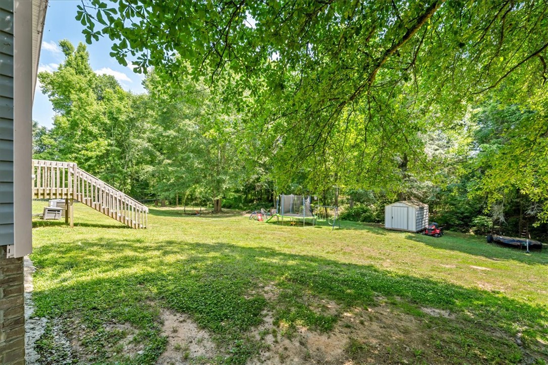 116 Parkview Road Iva, SC 29655 - Photo 38 of 44 A spacious, verdant yard with mature trees offers ample room for outdoor recreation and relaxation.