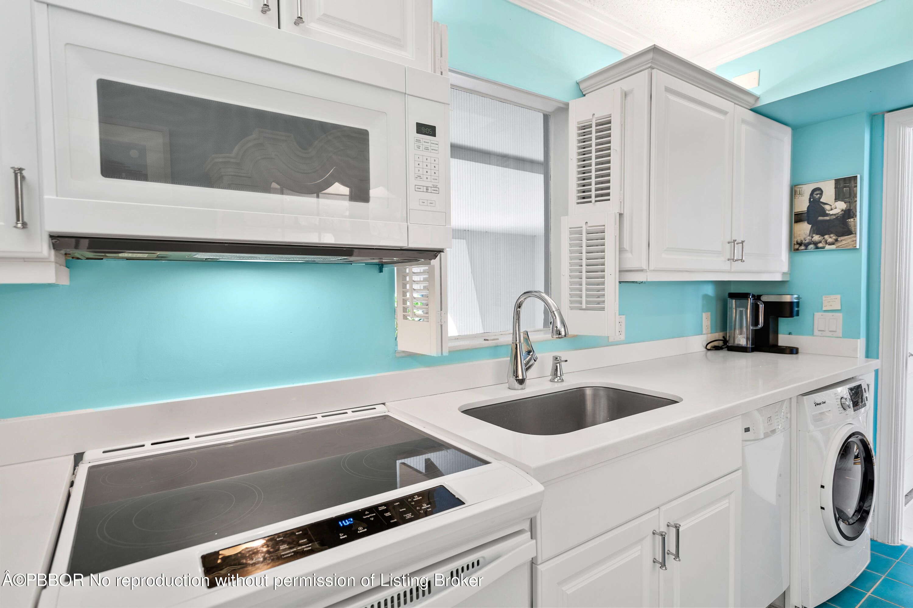 Undisclosed Address Palm Beach, FL 33480 - Photo 11 of 17 a kitchen with a sink and a microwave