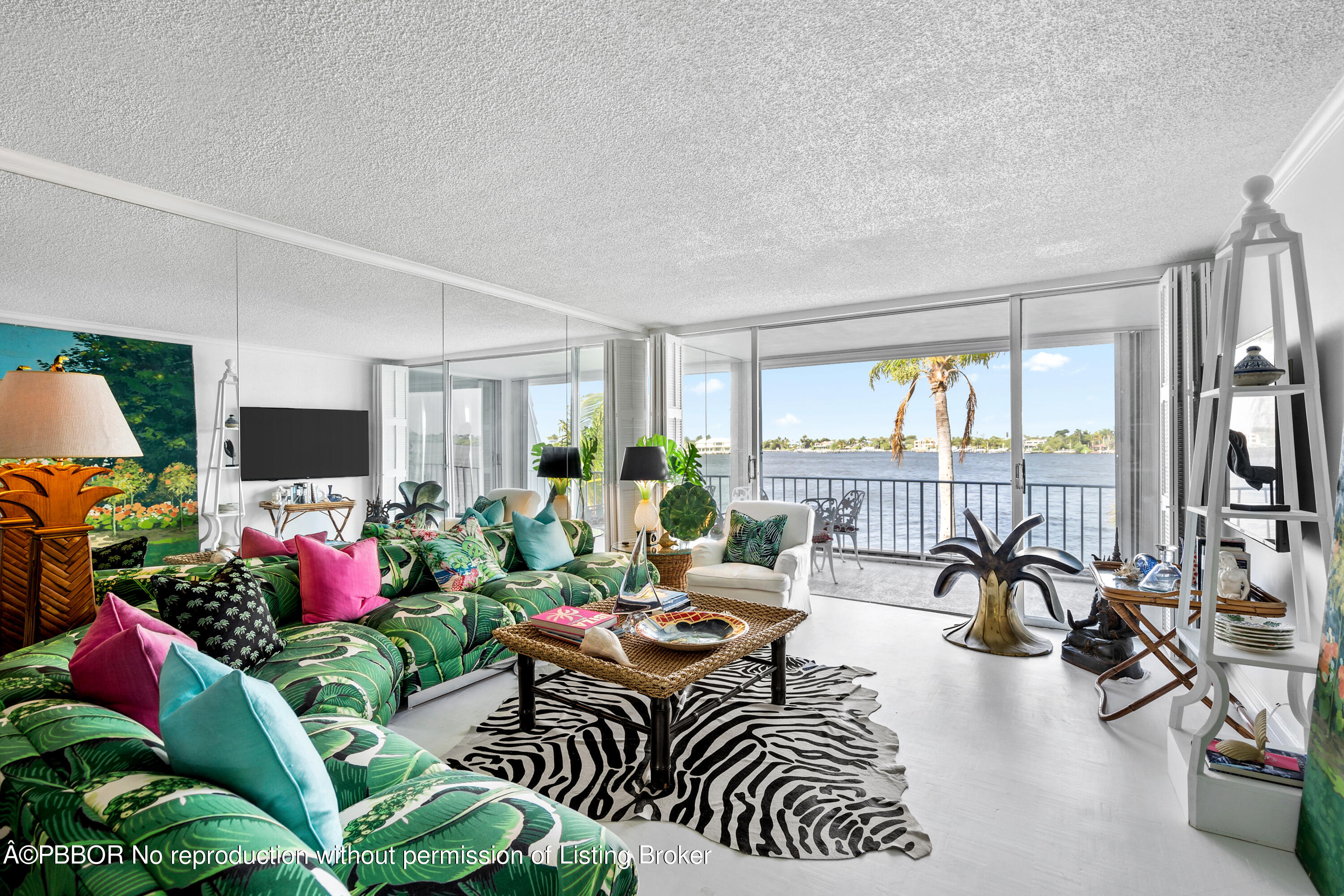 Undisclosed Address Palm Beach, FL 33480 - Photo 2 of 17 a living room with lots of furniture and a flat screen tv