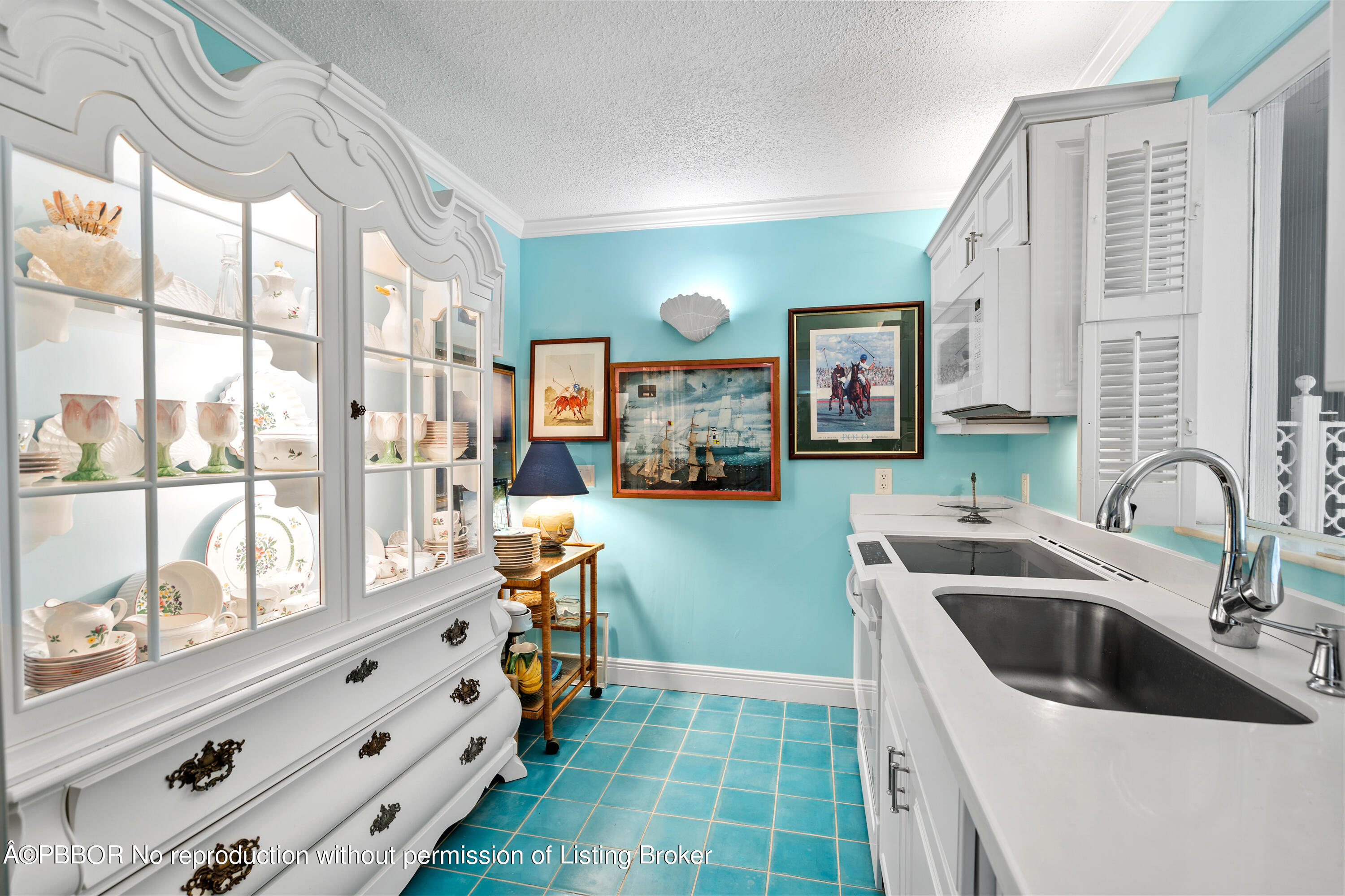 Undisclosed Address Palm Beach, FL 33480 - Photo 10 of 17 a kitchen that has a sink and a stove in it