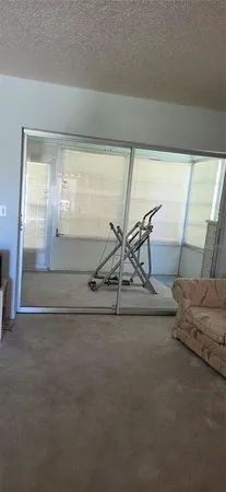 a bedroom with a bed dresser and a window