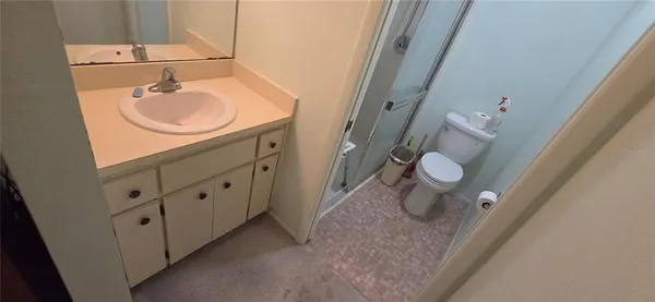 a view of a livingroom with furniture and windows