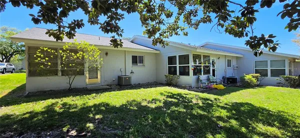 a view of a wardrobe space with a door