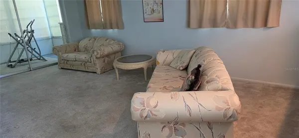 a bathroom with a granite countertop toilet and a shower