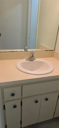 a sign board on a brick wall