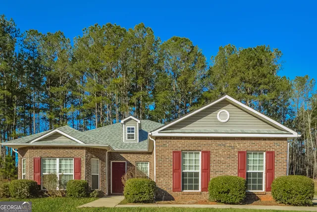 front view of a house with a yard