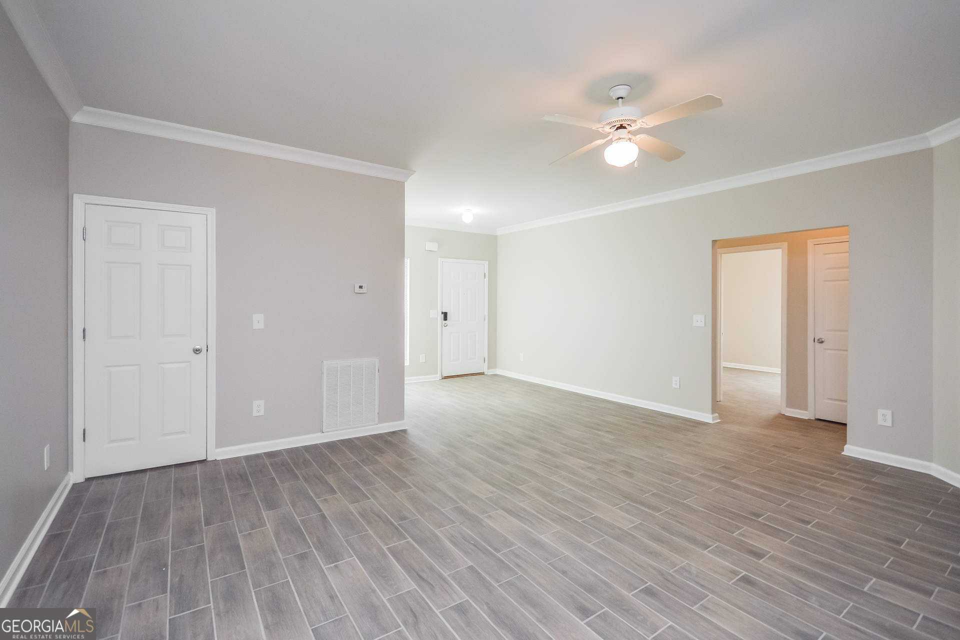 70 Joshua Creek Road Covington, GA 30016 - Photo 2 of 15 a view of an empty room with wooden floor