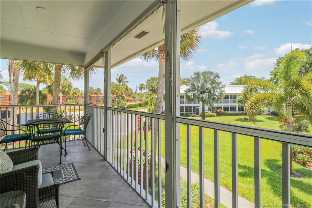 1852 Southwest Palm City Road, Unit 201 Stuart, FL 34994 - Photo 10 of 34 a view of a city from a balcony