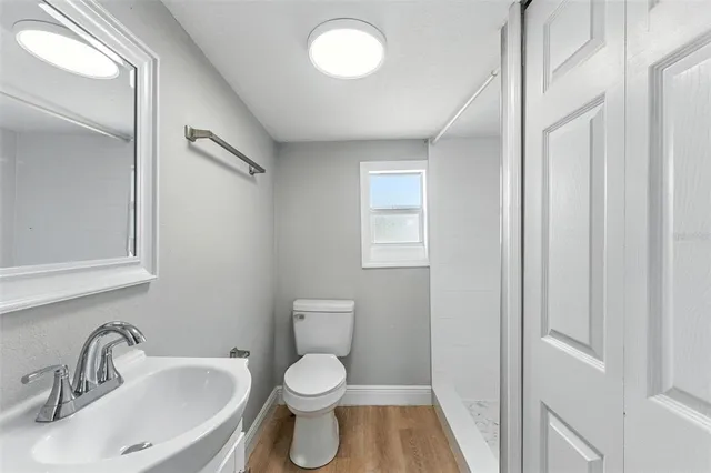 a bathroom with a sink toilet and vanity