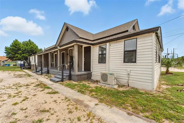 a view of house with wooden fence