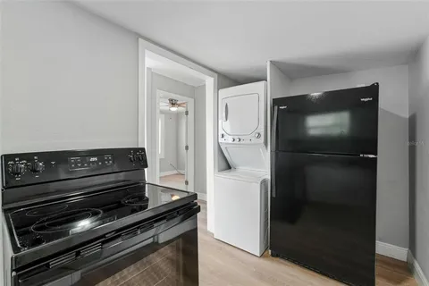 a kitchen with a stove and a refrigerator