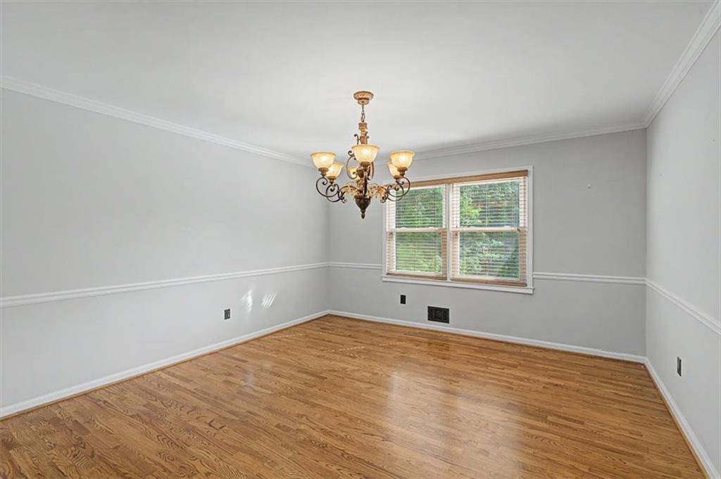 4510 North Slope Circle Marietta, GA 30066 - Photo 21 of 37 a view of a room with wooden floor and chandelier