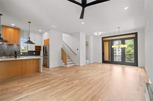 a view of a kitchen with cabinet and a chandelier